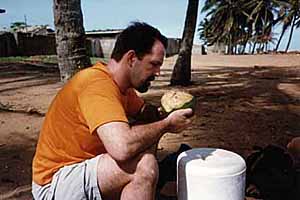 Brian drinks the musky coconut water.