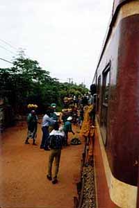 Food vendors rush up to the train.